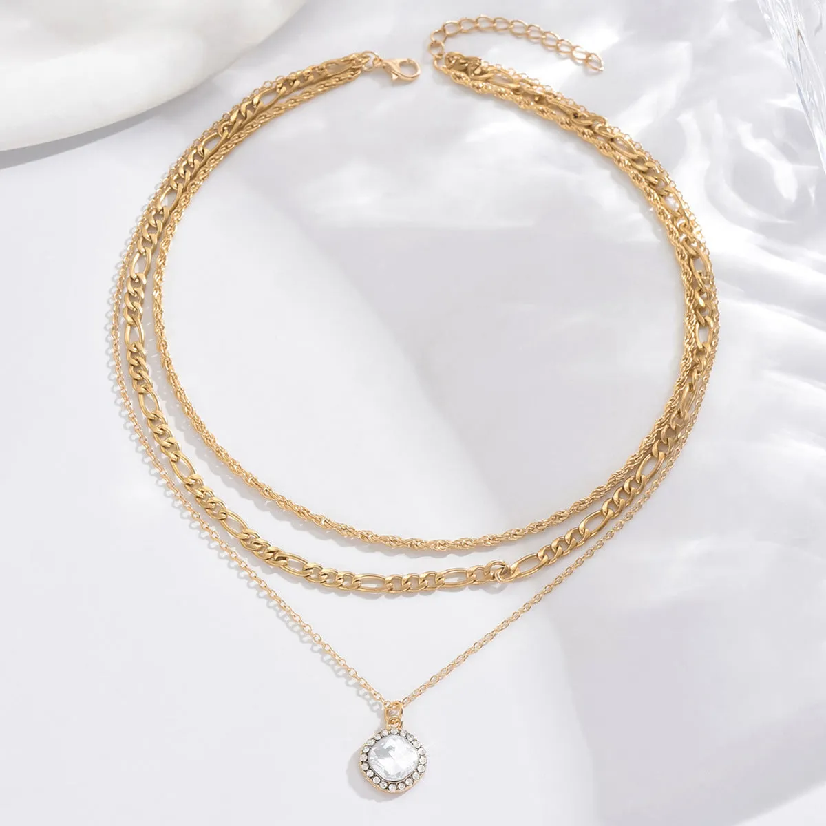 Gold multi-layer pendant necklace with large hemp flowers chain and round geometric pendants on alloy base