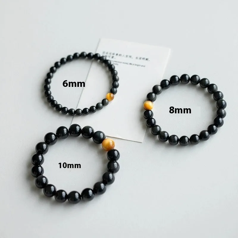 Black geometric obsidian bead bracelet shown in three size options: 6mm, 8mm, and 10mm beads.