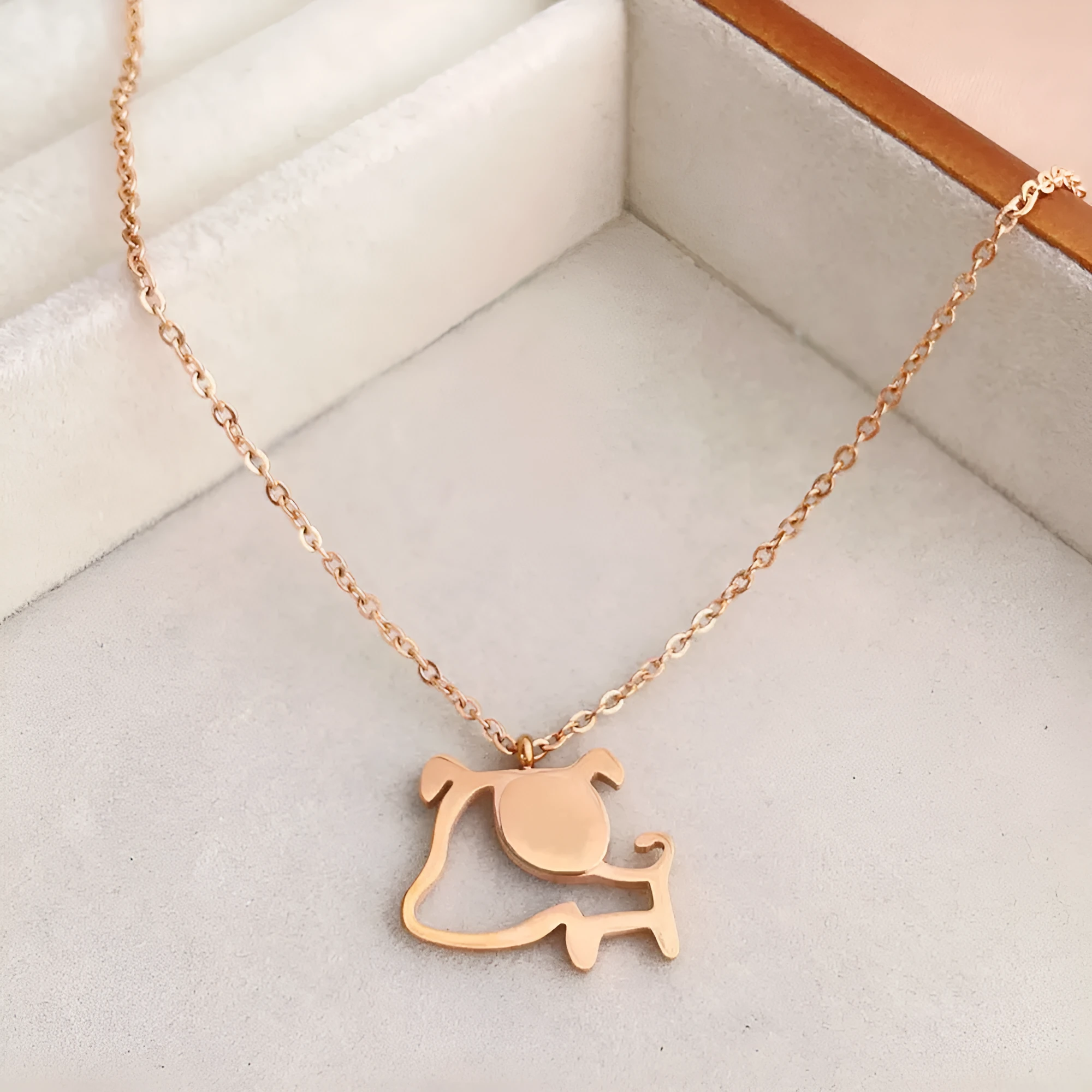 Rose gold titanium steel clavicle chain necklace with geometric line design on white background