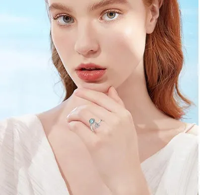 Rotating moonstone ring with adjustable opening, white gold electroplated finish, geometric circle and triangle design