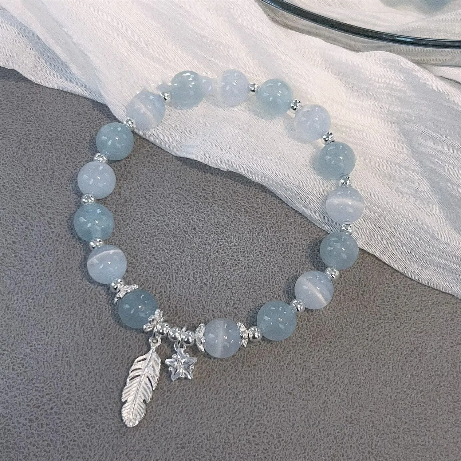 Korean style glass crystal bracelet with feather XingX blue moonlight colour and eight Awn star design