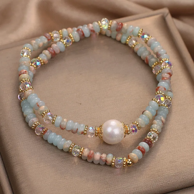 Natural colour Shoushan stone double circle bracelet with crystal one pearl on white background