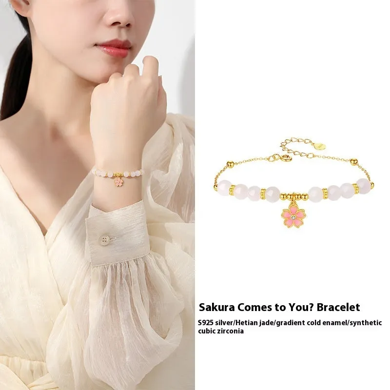 Pink women's bracelet with 925 silver cherry blossom pendant, Hetian jade beads, and gradient epoxy details.