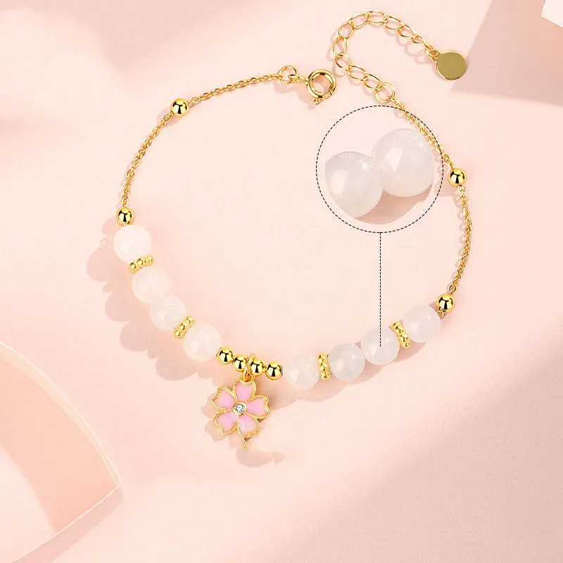 Pink women's bracelet with 925 silver cherry blossom pendant, Hetian jade beads, and gradient epoxy details.