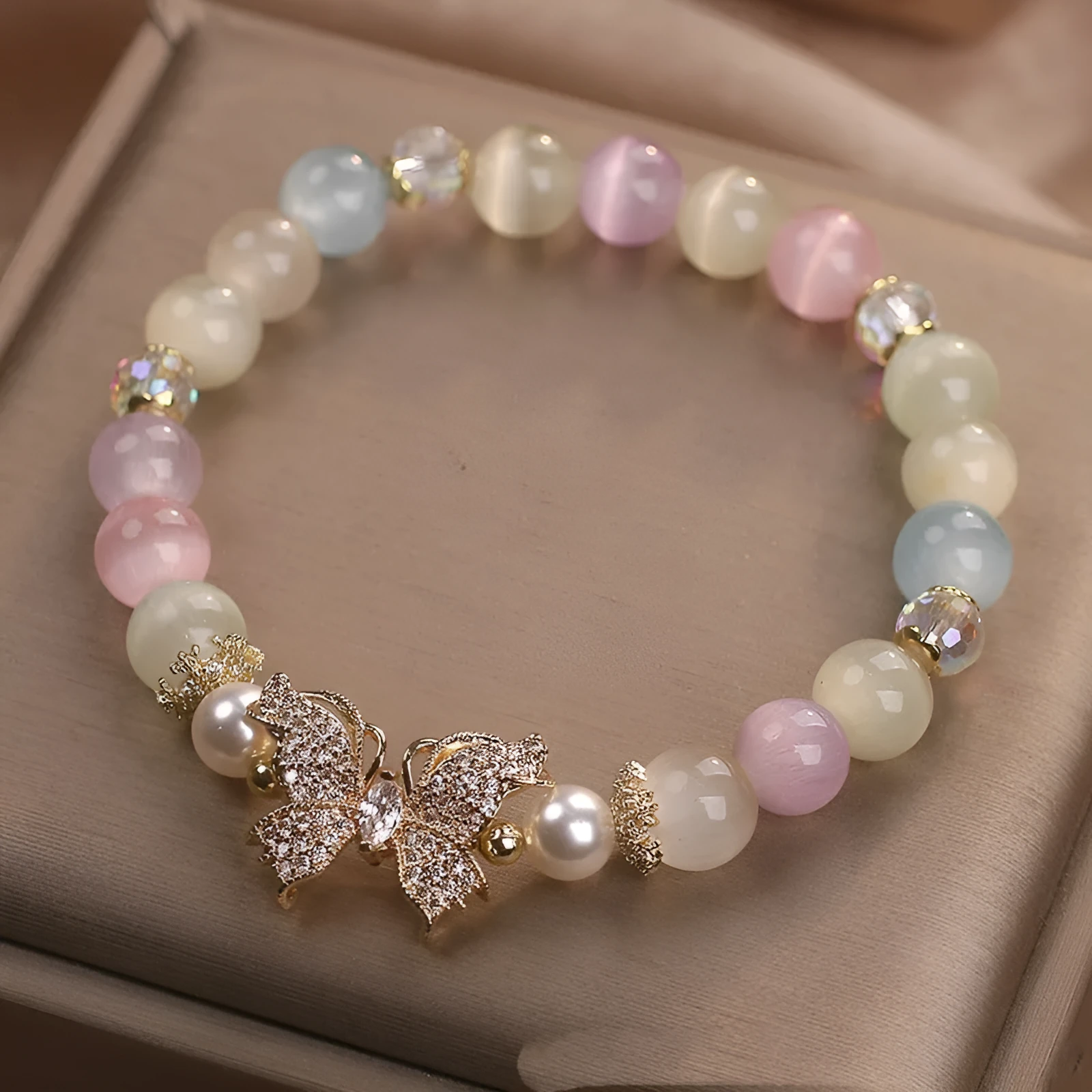 Natural stone bracelet with golden moonstone and butterfly design for women