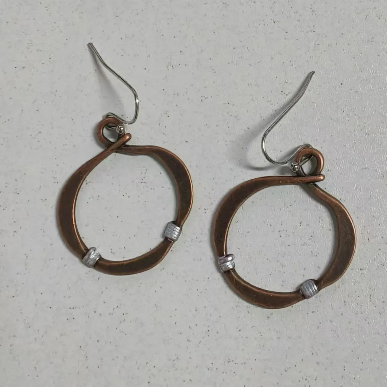 Bronze retro hollow round geometric bohemian earrings for women on light background