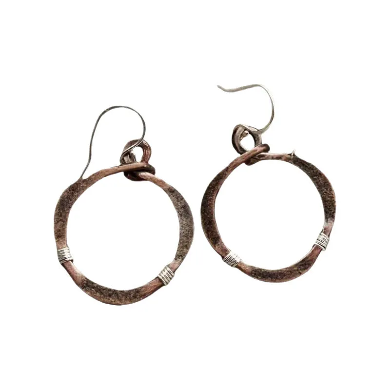 Bronze retro hollow round geometric bohemian earrings for women on light background
