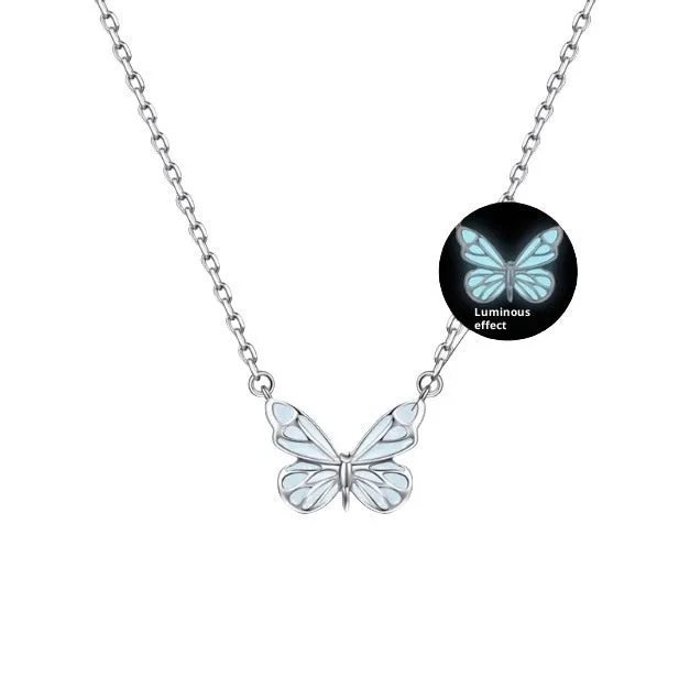 Set of 925 silver luminous butterfly bracelet necklace and earrings with floral petals on white background