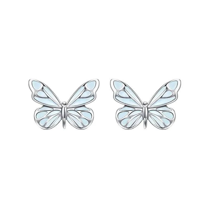Set of 925 silver luminous butterfly bracelet necklace and earrings with floral petals on white background