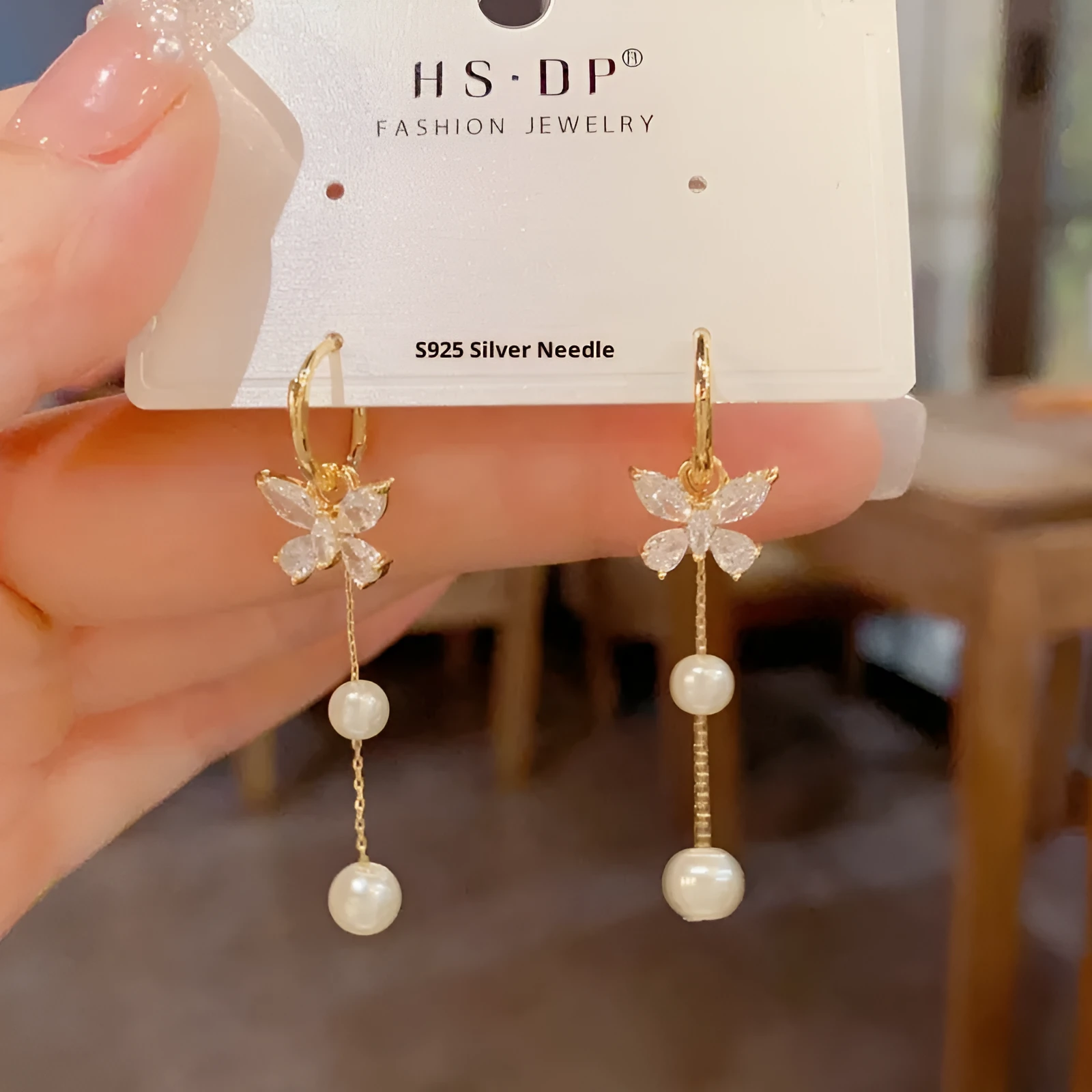 One pair of gold plated copper ear clips with butterfly pearl tassel design, clip-on style for women