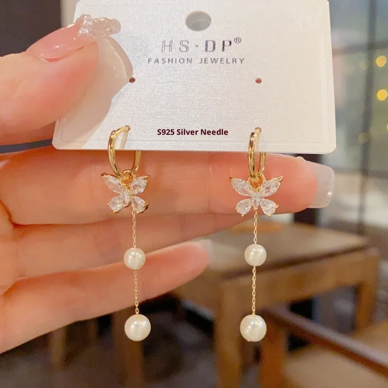 One pair of gold plated copper ear clips with butterfly pearl tassel design, clip-on style for women