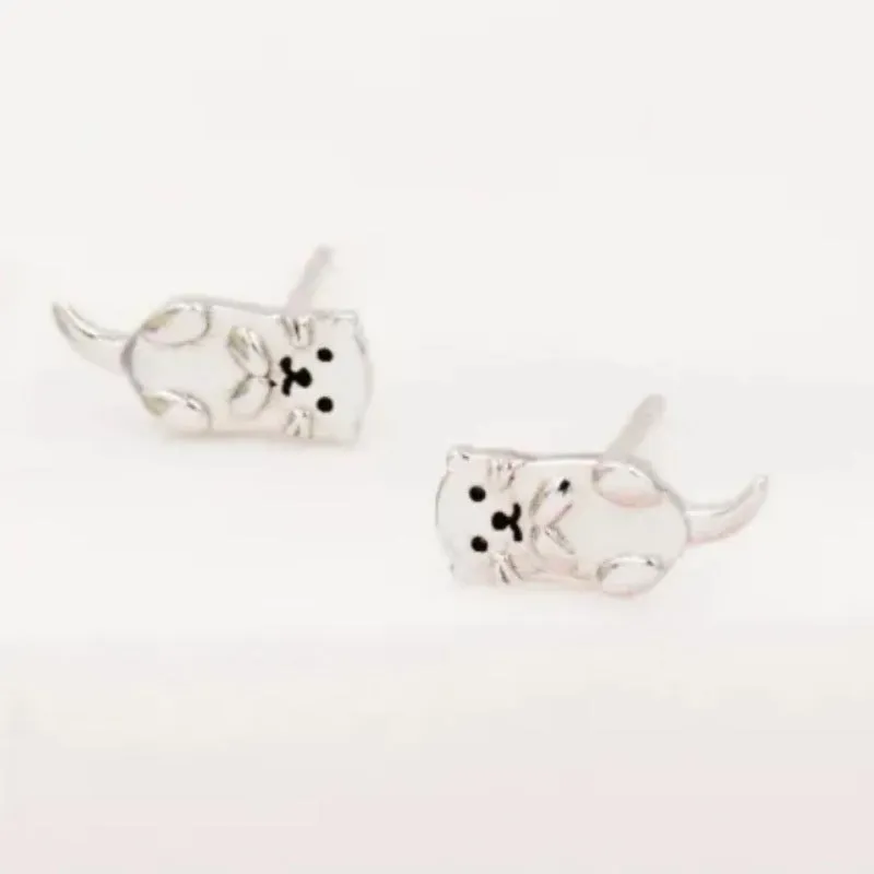 Simple compact three-dimensional animal-shaped copper earrings with electroplated finish in white gold colour