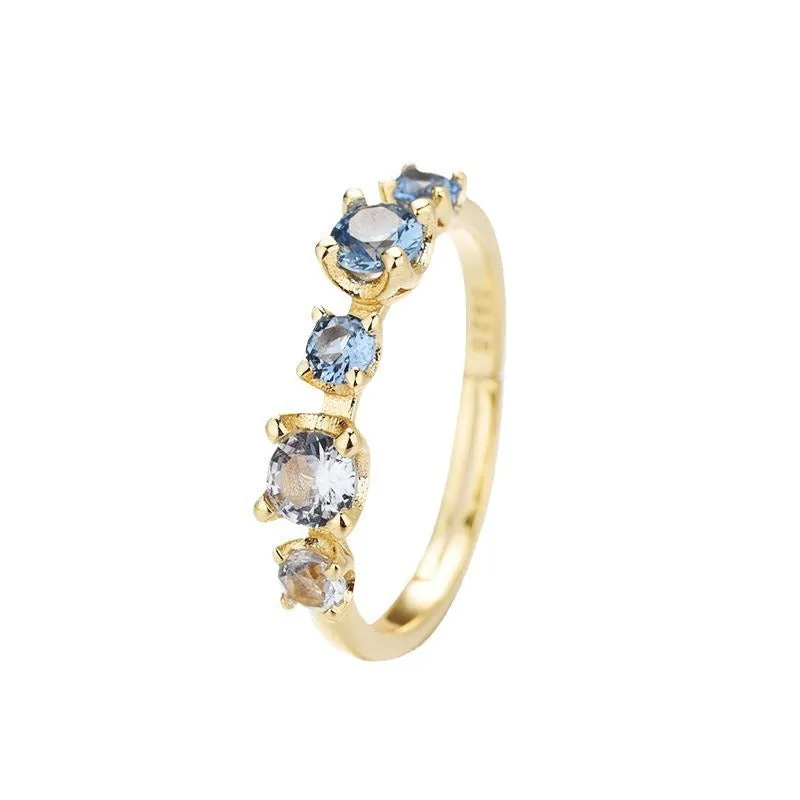 Gradient blue and white topaz multi-gemstone zircon ring with adjustable open mouth design