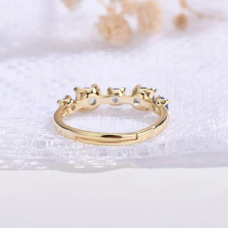 Gradient blue and white topaz multi-gemstone zircon ring with adjustable open mouth design