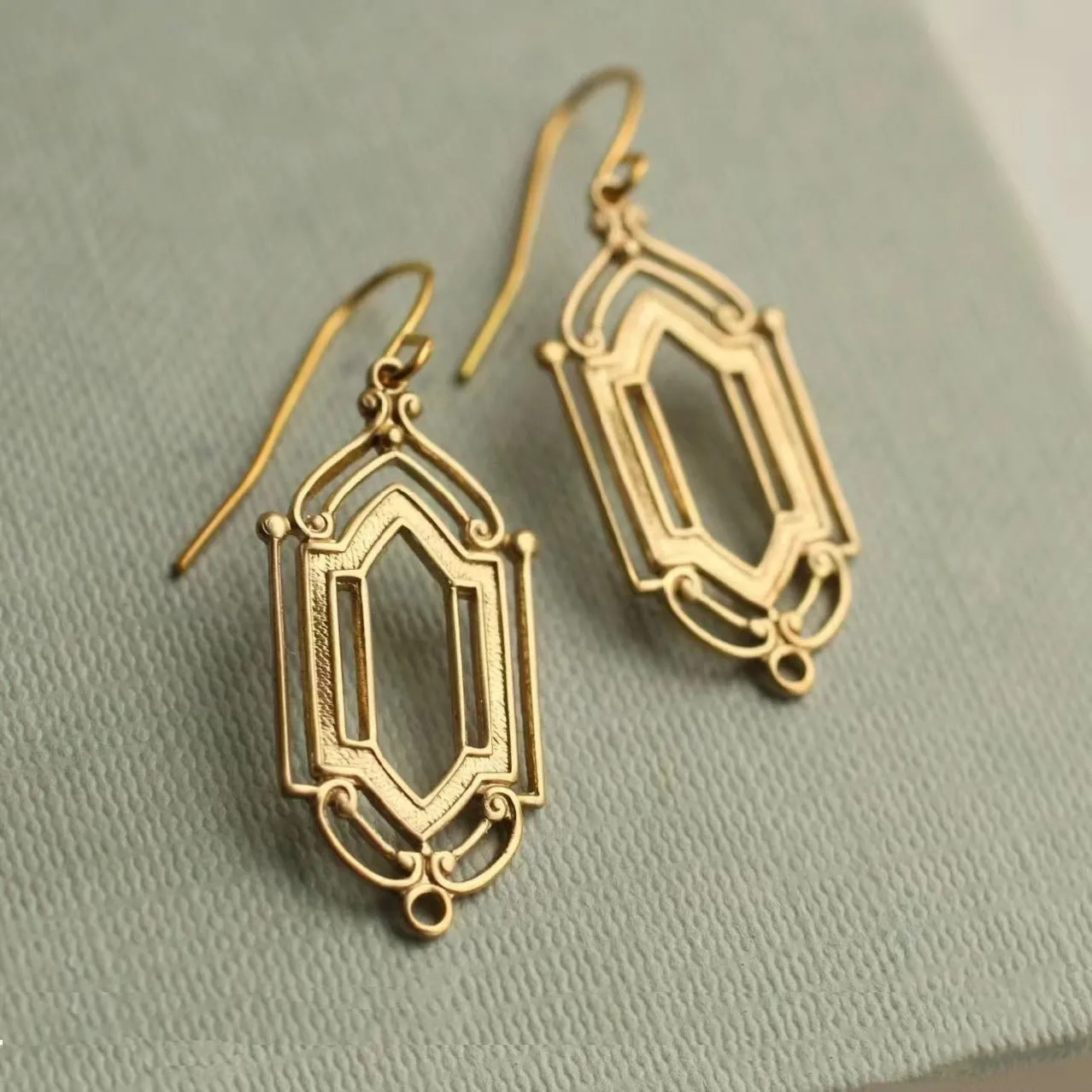 Gold flower window hollow stud earrings on copper base with geometric shape