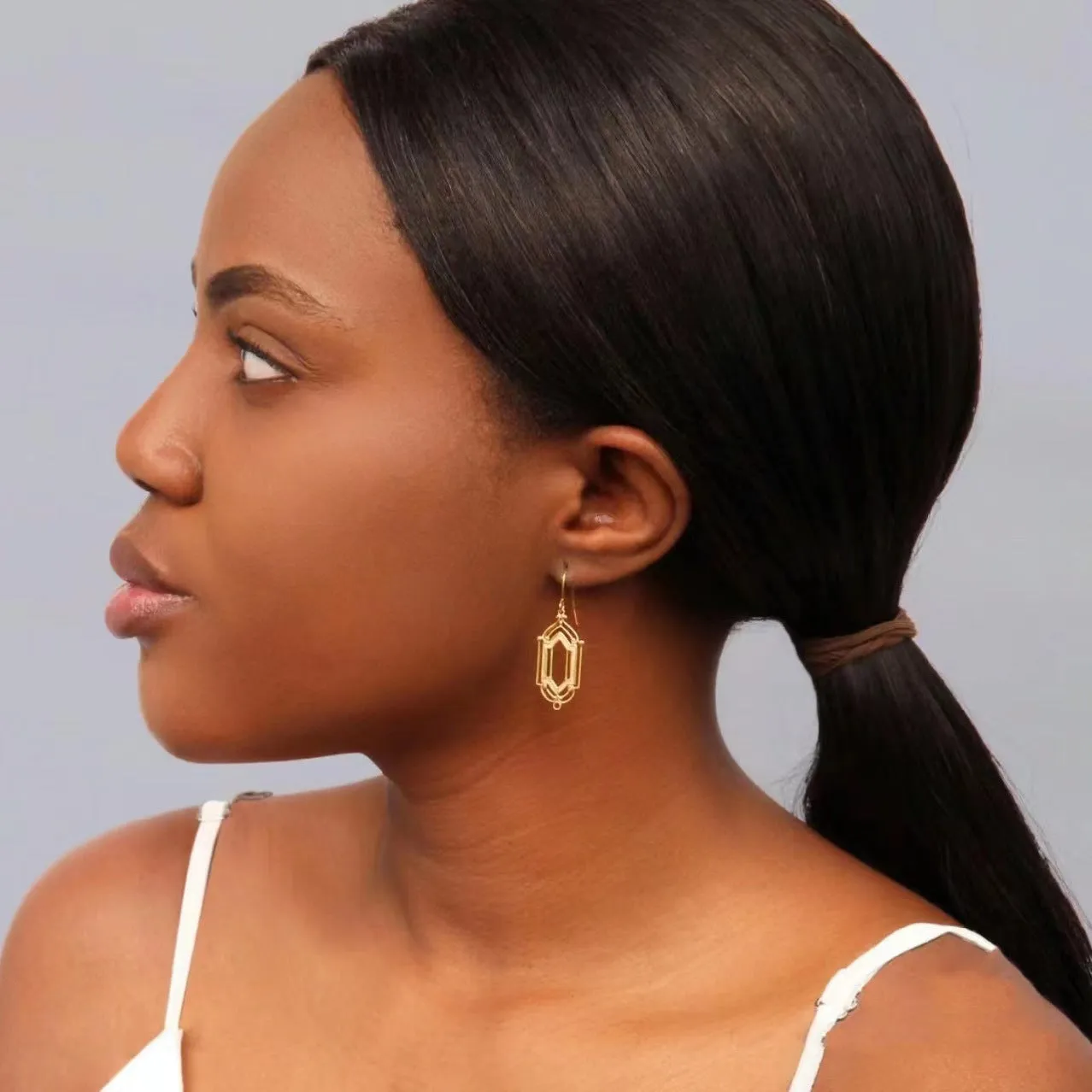 Gold flower window hollow stud earrings on copper base with geometric shape