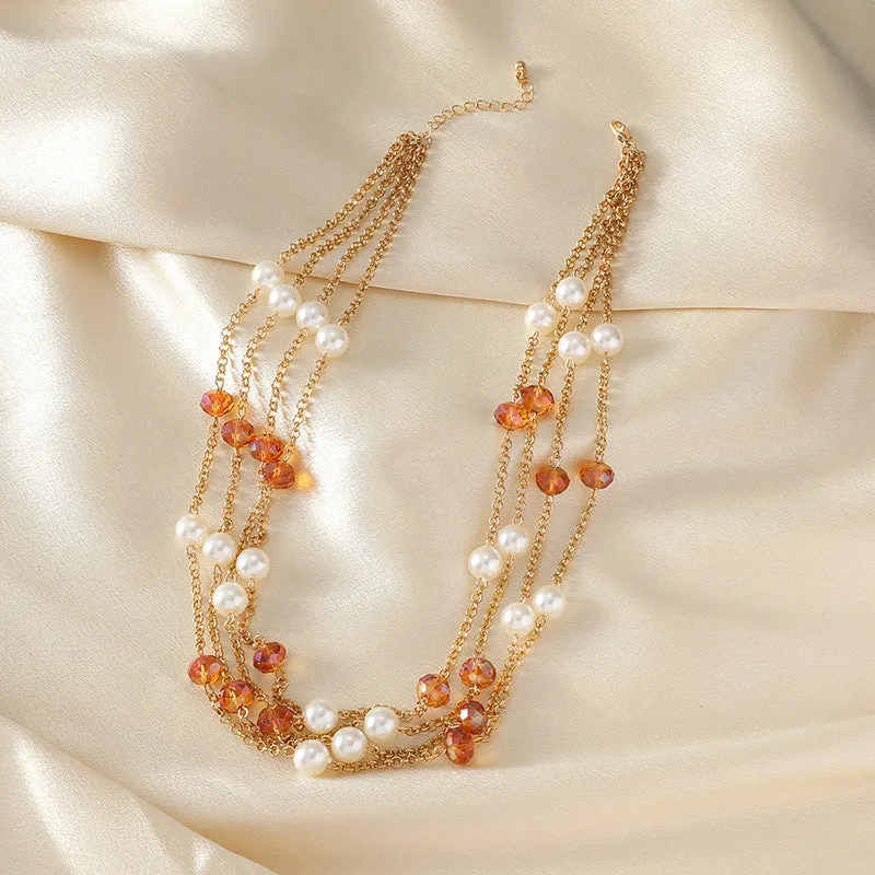 Women's sweater necklace with pearl crystal chain and round geometric alloy pendant in multiple colour options