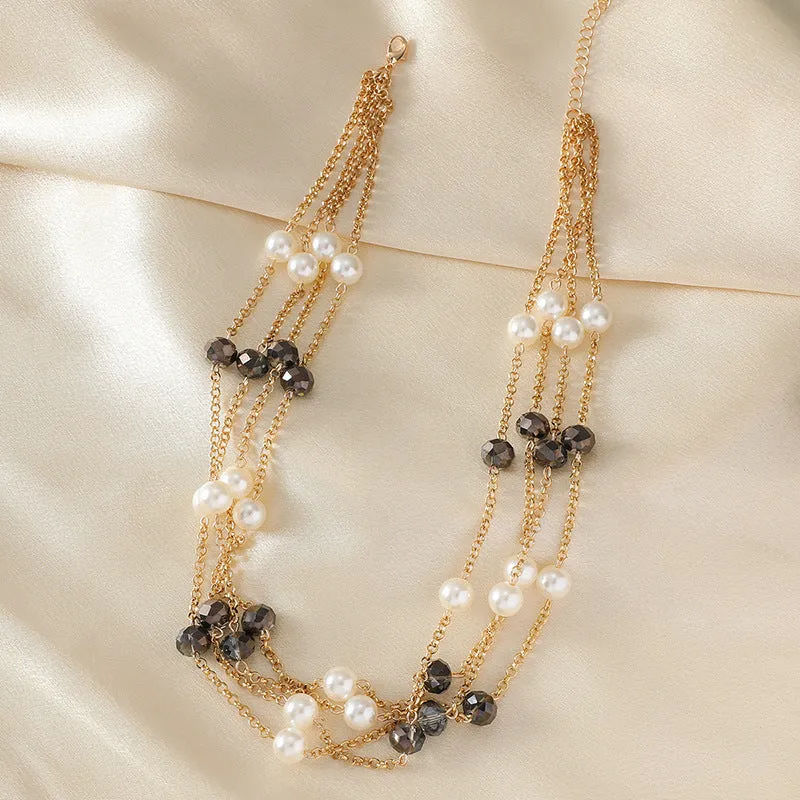 Women's sweater necklace with pearl crystal chain and round geometric alloy pendant in multiple colour options