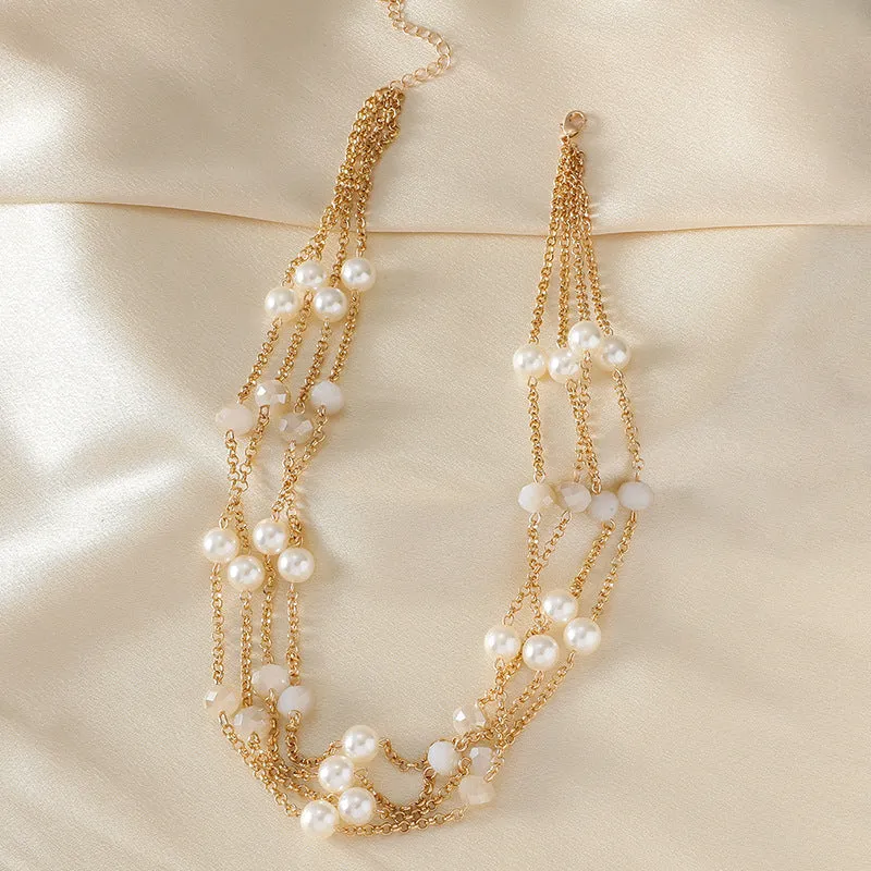 Women's sweater necklace with pearl crystal chain and round geometric alloy pendant in multiple colour options