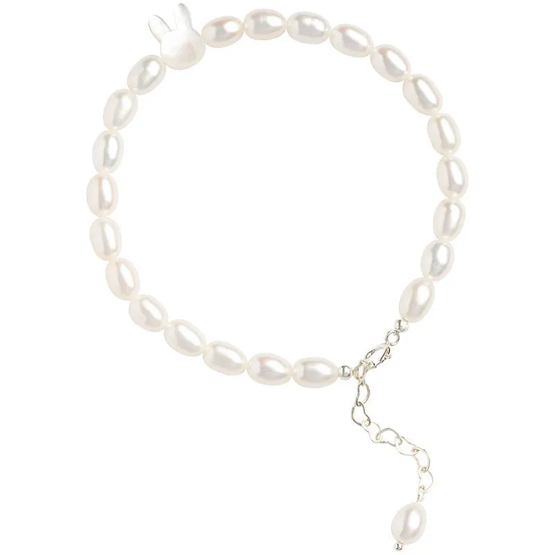 White pearl and 925 silver rabbit charm bracelet on a 16cm elastic string.