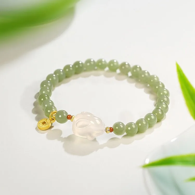 Handmade glass rabbit charm bracelet for women with coloured glaze details