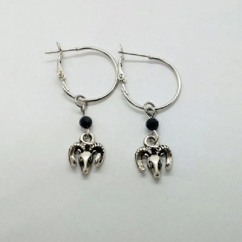 Silver round ring earrings for women with Tibetan antelope style design.