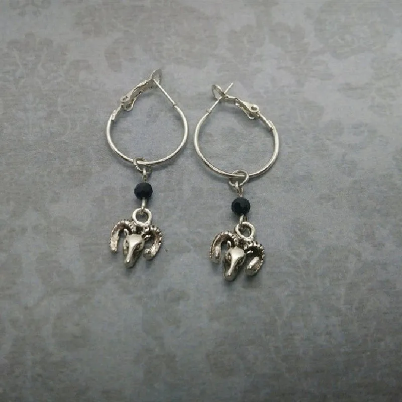 Silver round ring earrings for women with Tibetan antelope style design.