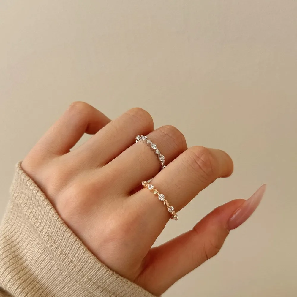 Silver heart shape slim ring for women in platinum finish, side view showing polished surface
