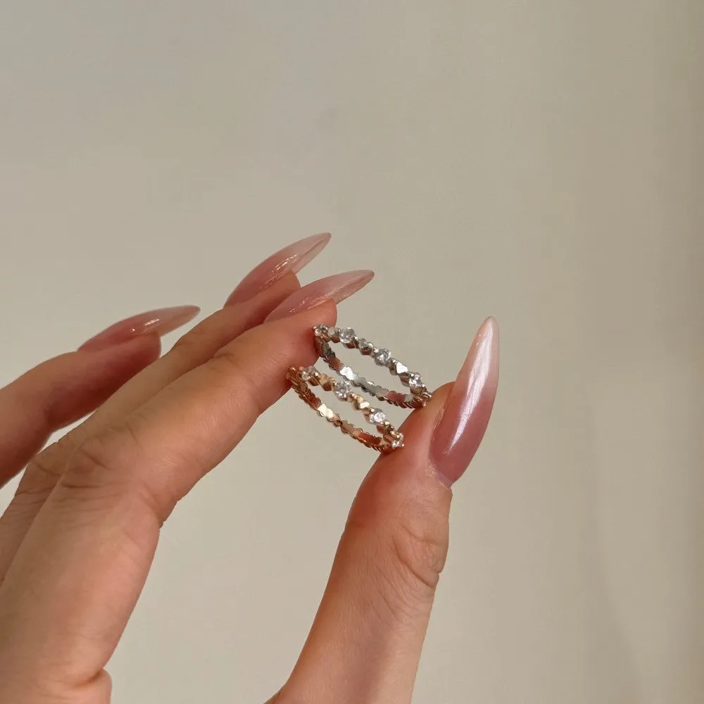 Silver heart shape slim ring for women in platinum finish, side view showing polished surface