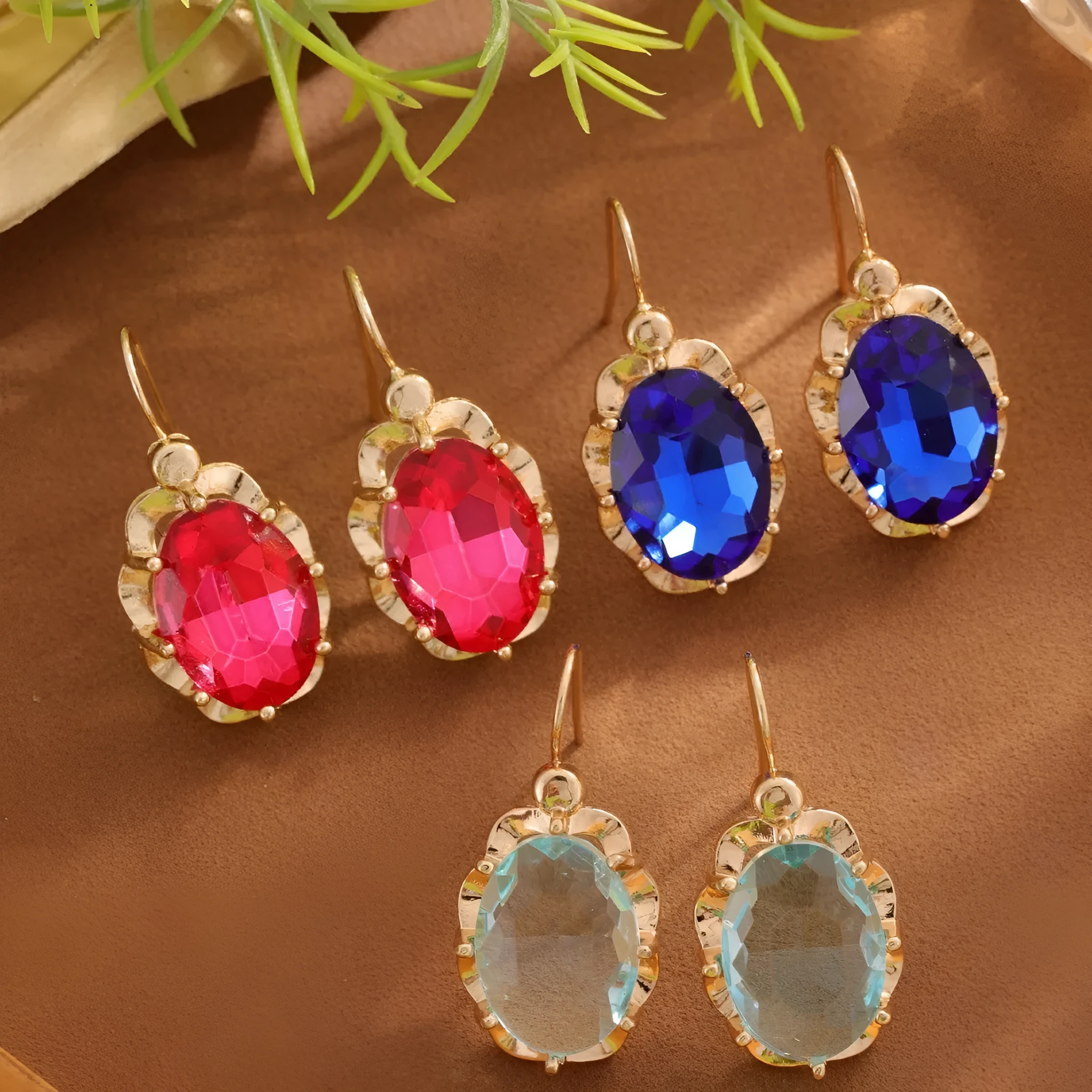 Pair of diamond studded earrings in polished zinc alloy, available in light blue, rose red, and royal blue colours
