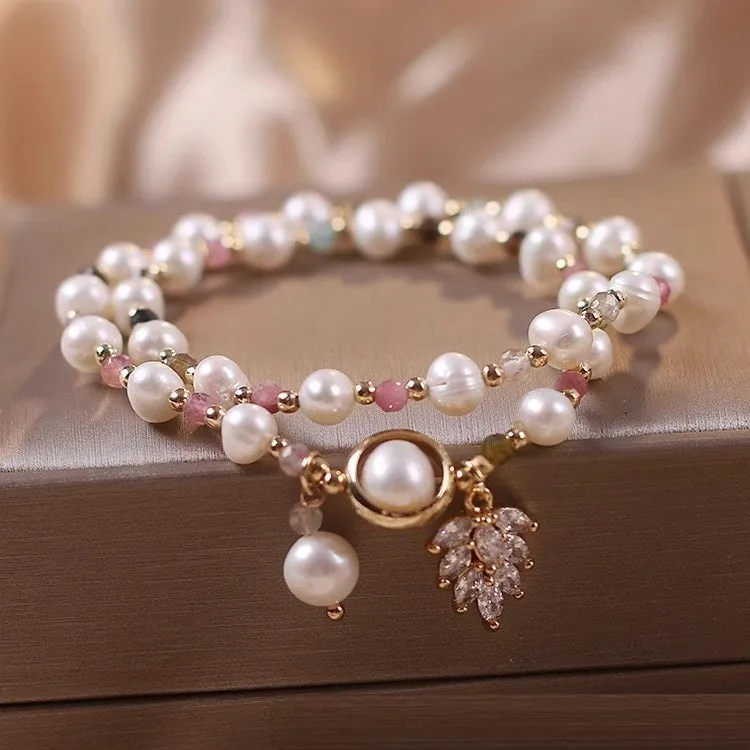 Women's double circle crystal bracelet with flower-shaped crystal detail in Strawberry Quartz colour