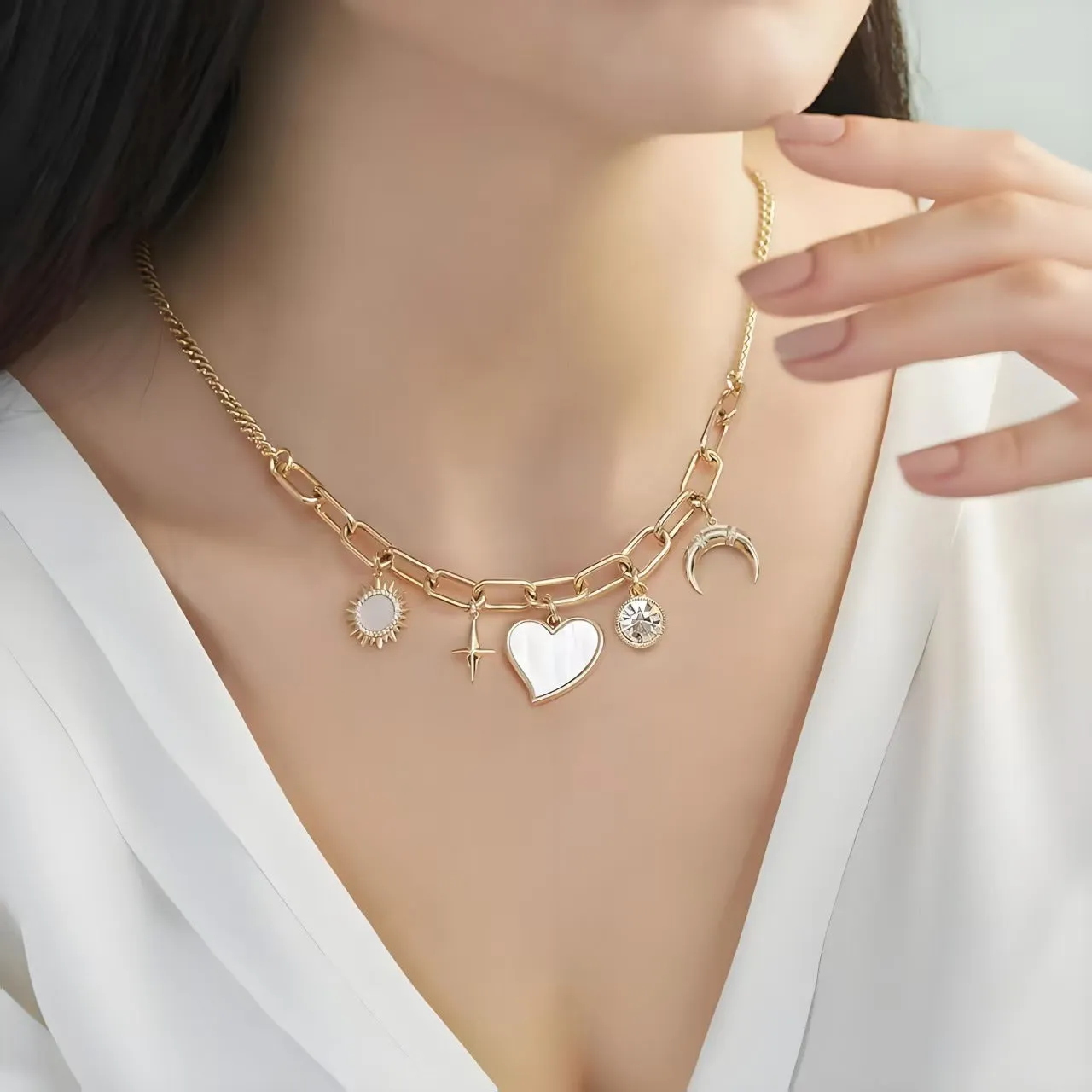 Gold alloy pendant necklace with moon inlaid heart-shaped and star-shaped zircon on a bamboo chain