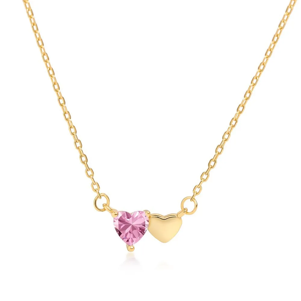 925 silver heart necklace with emerald zircon in gold finish on display