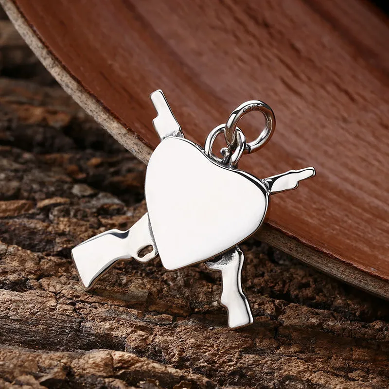925 sterling silver pendant with dual gun heart-shaped design, 34 by 31 millimetres, silver colour