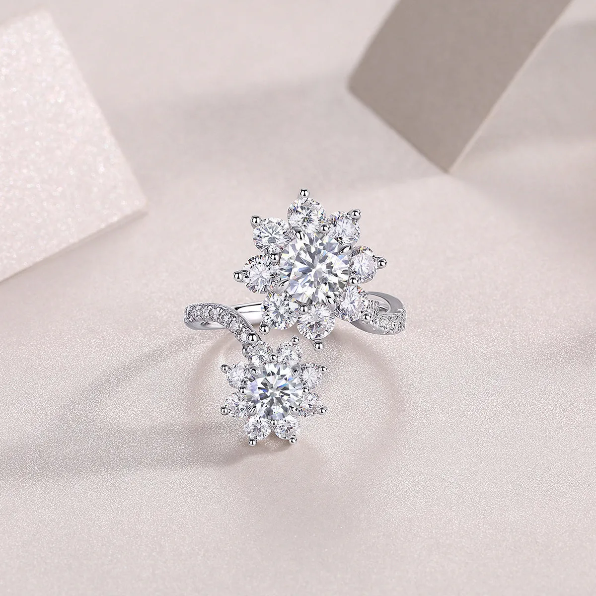 1 carat moissanite wedding ring set in S925 silver with platinum plating on a white background with gift box