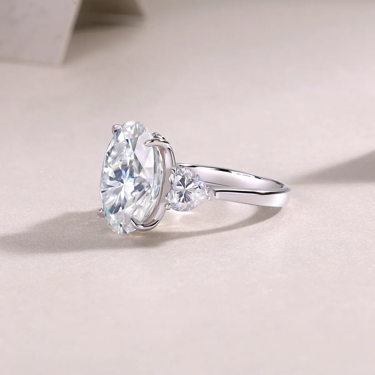 Soul Resonance wedding ring set with egg-shaped moissanite in platinum-plated S925 silver on a white background