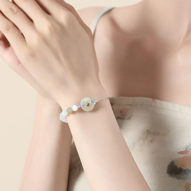 Women's silver bracelet with peach blossom design and safety buckle in New Chinese style jewellery