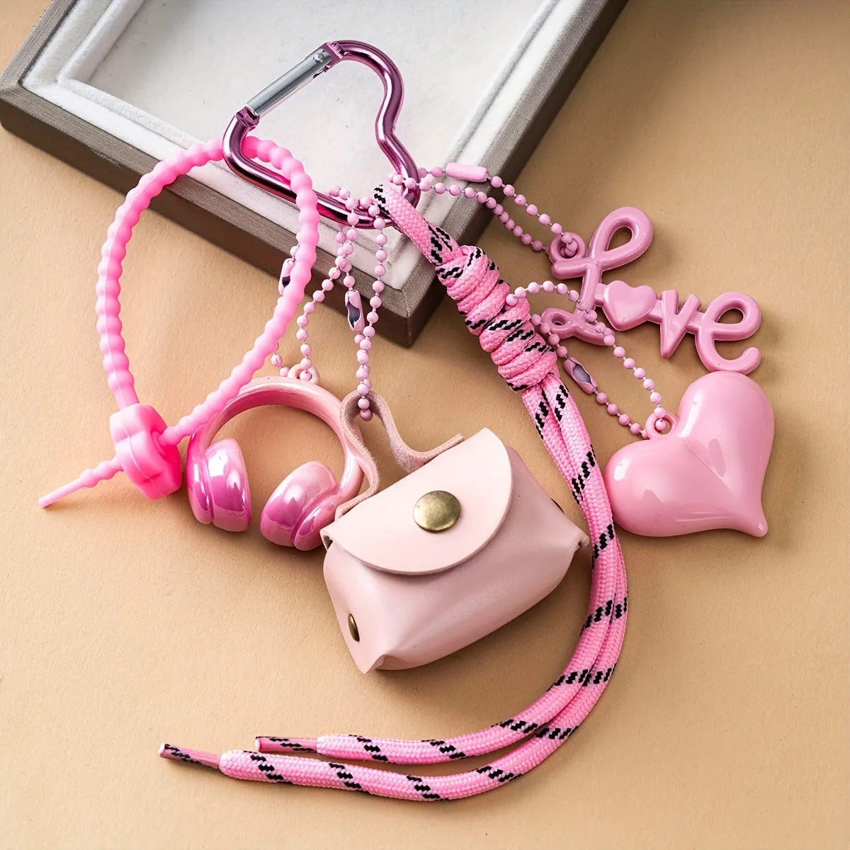 Fashion bow earphone Miu series braided rope bag pendant keychain in black with bow detail
