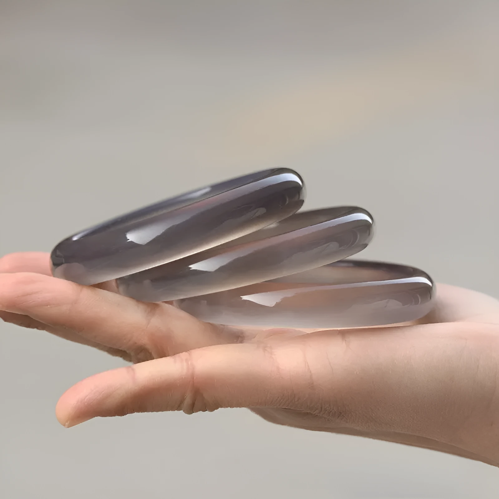 Dark grey iced chalcedony agate women's bracelet with circle, ring and line design elements