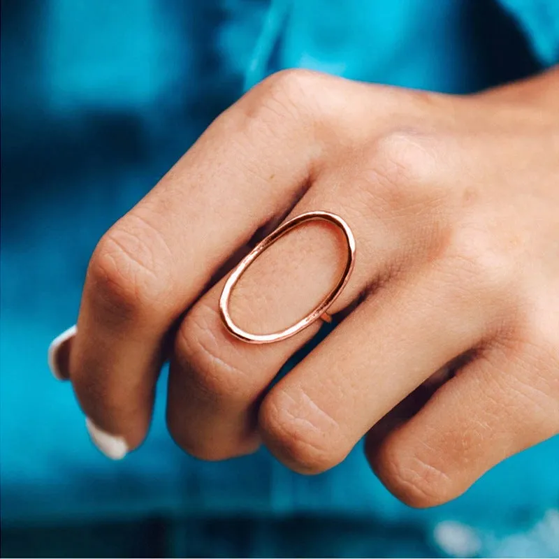 Classic minimalist copper ring with zircon inlay in rose gold colour on white background