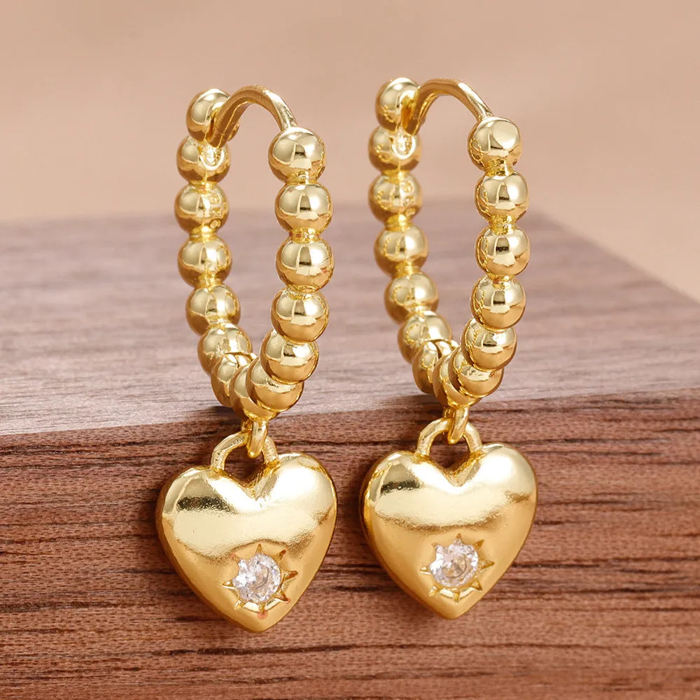 Pair of vintage gold heart earrings for women in cold wind style, copper construction, gold white colour