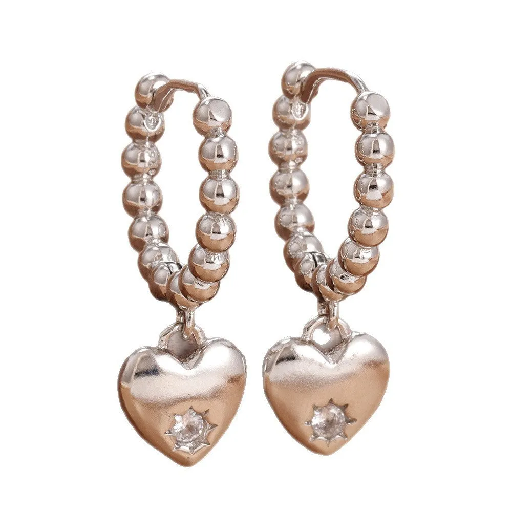 Pair of vintage gold heart earrings for women in cold wind style, copper construction, gold white colour