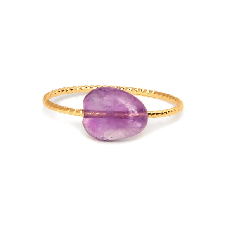 Geometric silver-tone ring with a coloured agate stone in a niche design, side view.