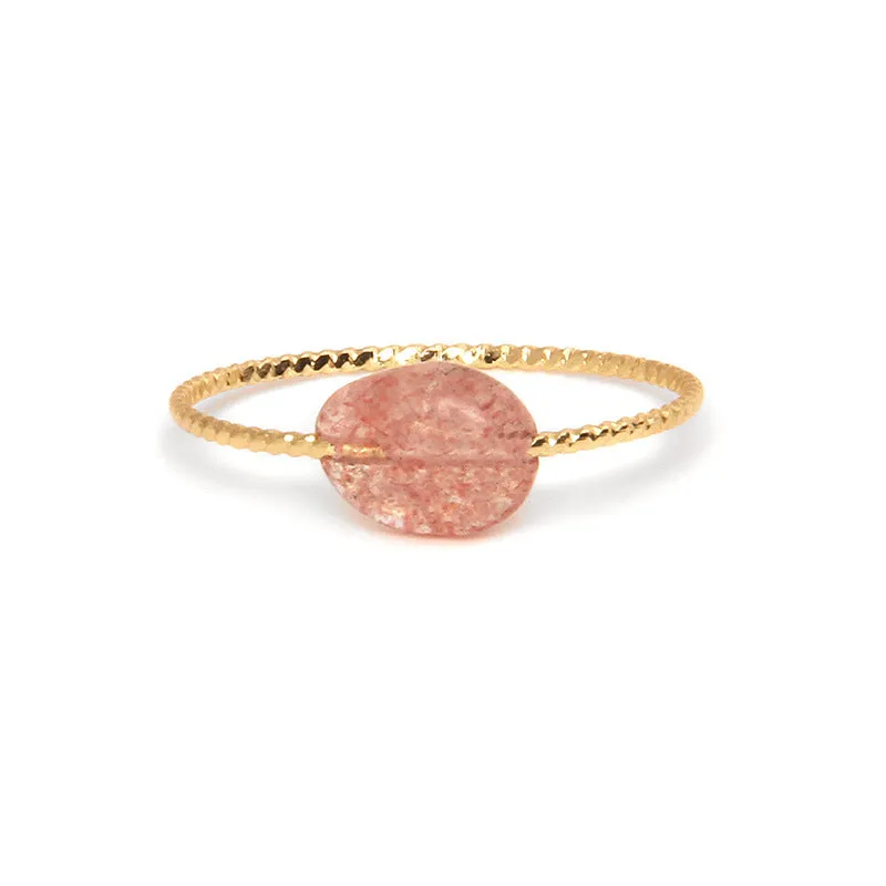Geometric silver-tone ring with a coloured agate stone in a niche design, side view.