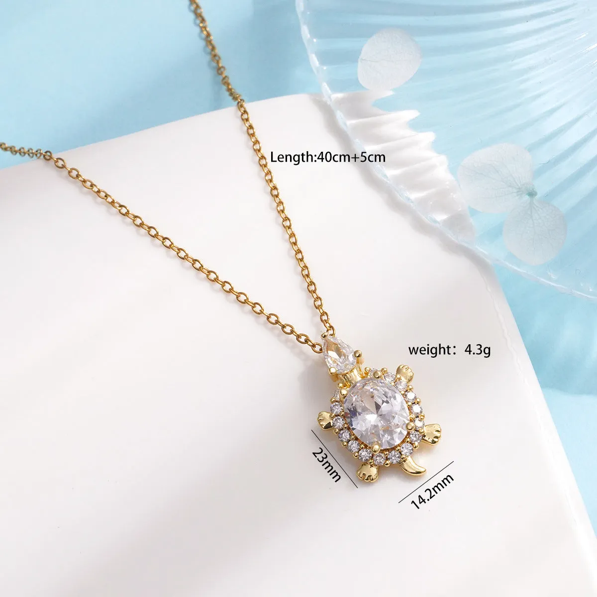 Gold-plated copper sea turtle necklace with zirconium accents and mixed gemstone inlay, O-link chain, light luxury style for women