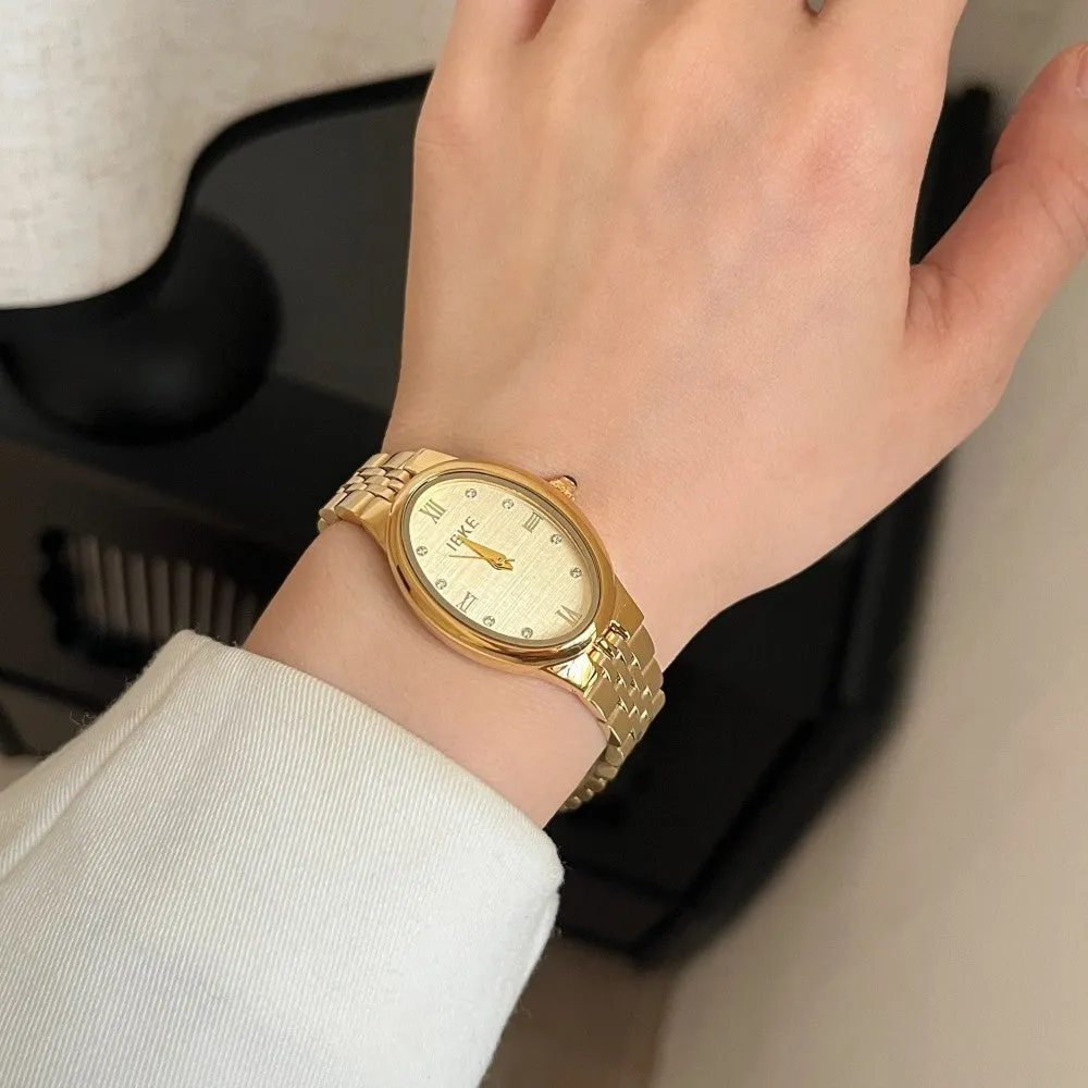 Oval dial ladies watch with dot markers, 37mm, gold strap and gold face