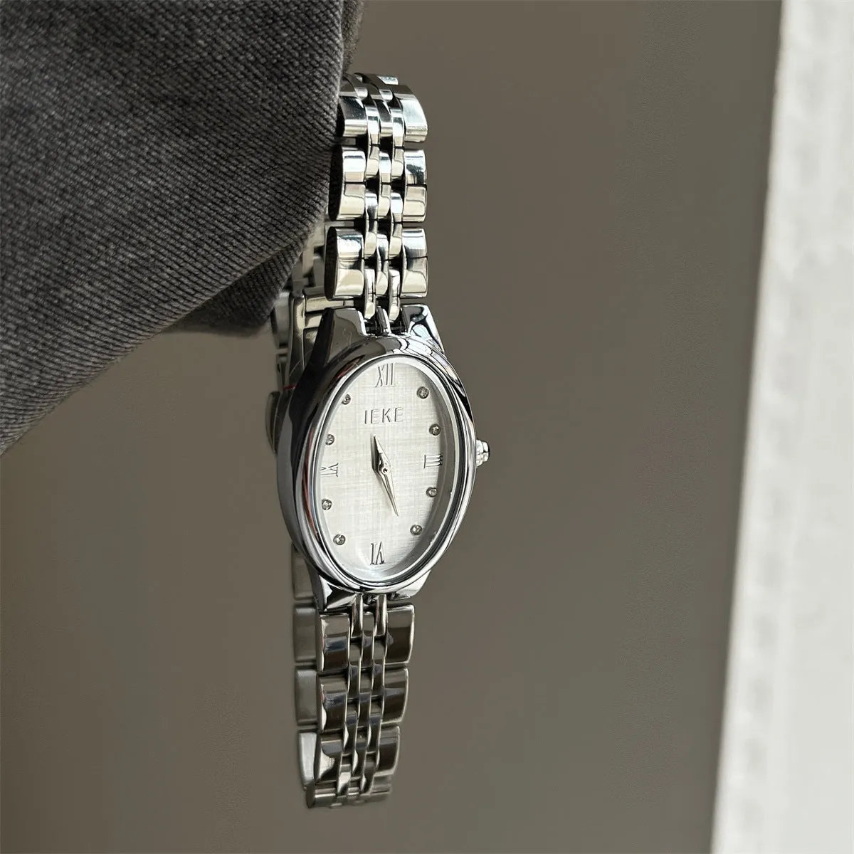 Oval dial ladies watch with dot markers, 37mm, gold strap and gold face