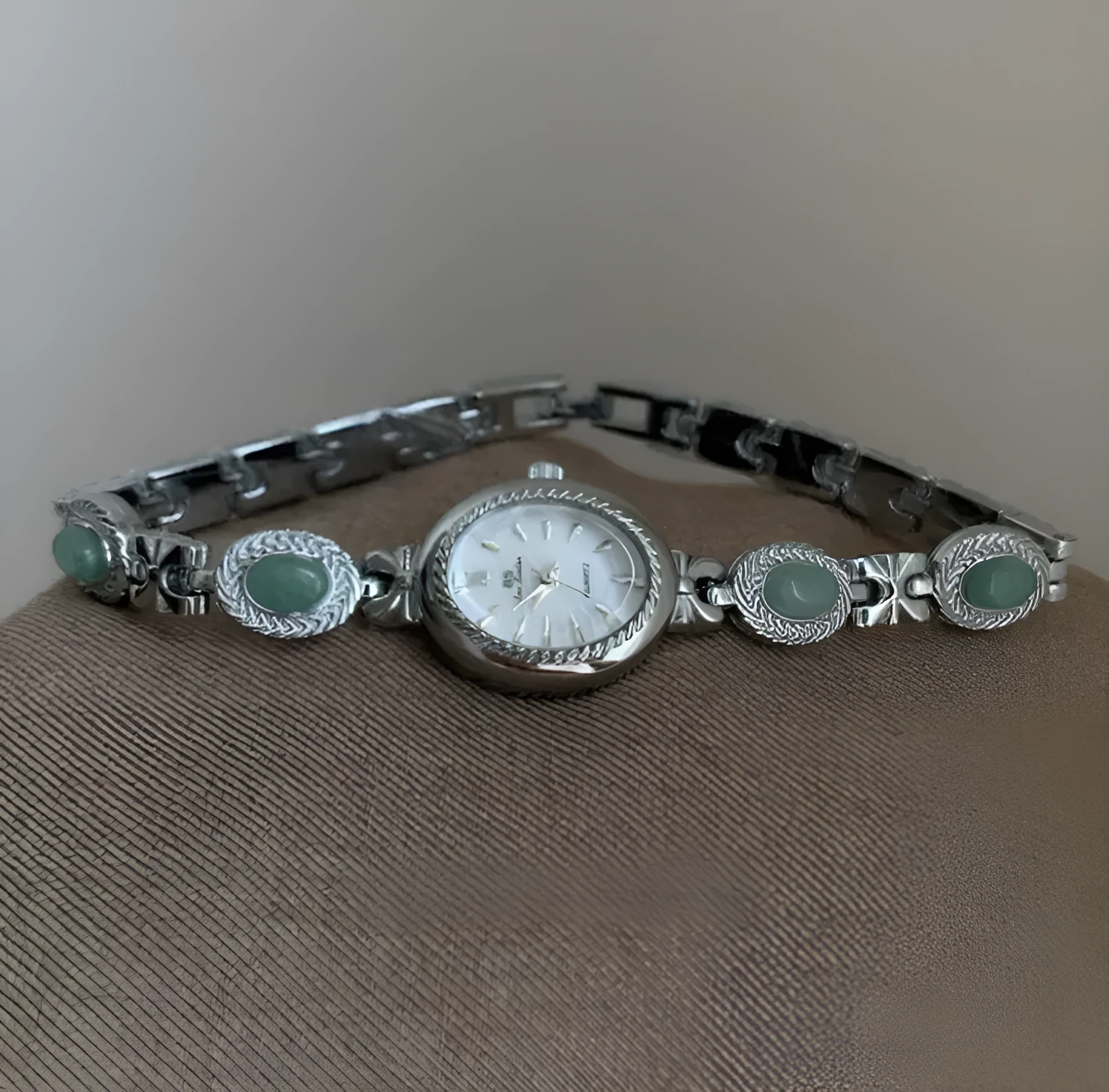 Green jade ladies quartz watch with silver case and white face