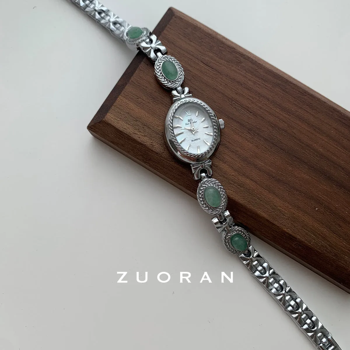 Green jade ladies quartz watch with silver case and white face