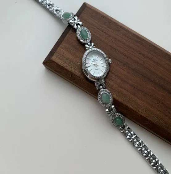 Green jade ladies quartz watch with silver case and white face